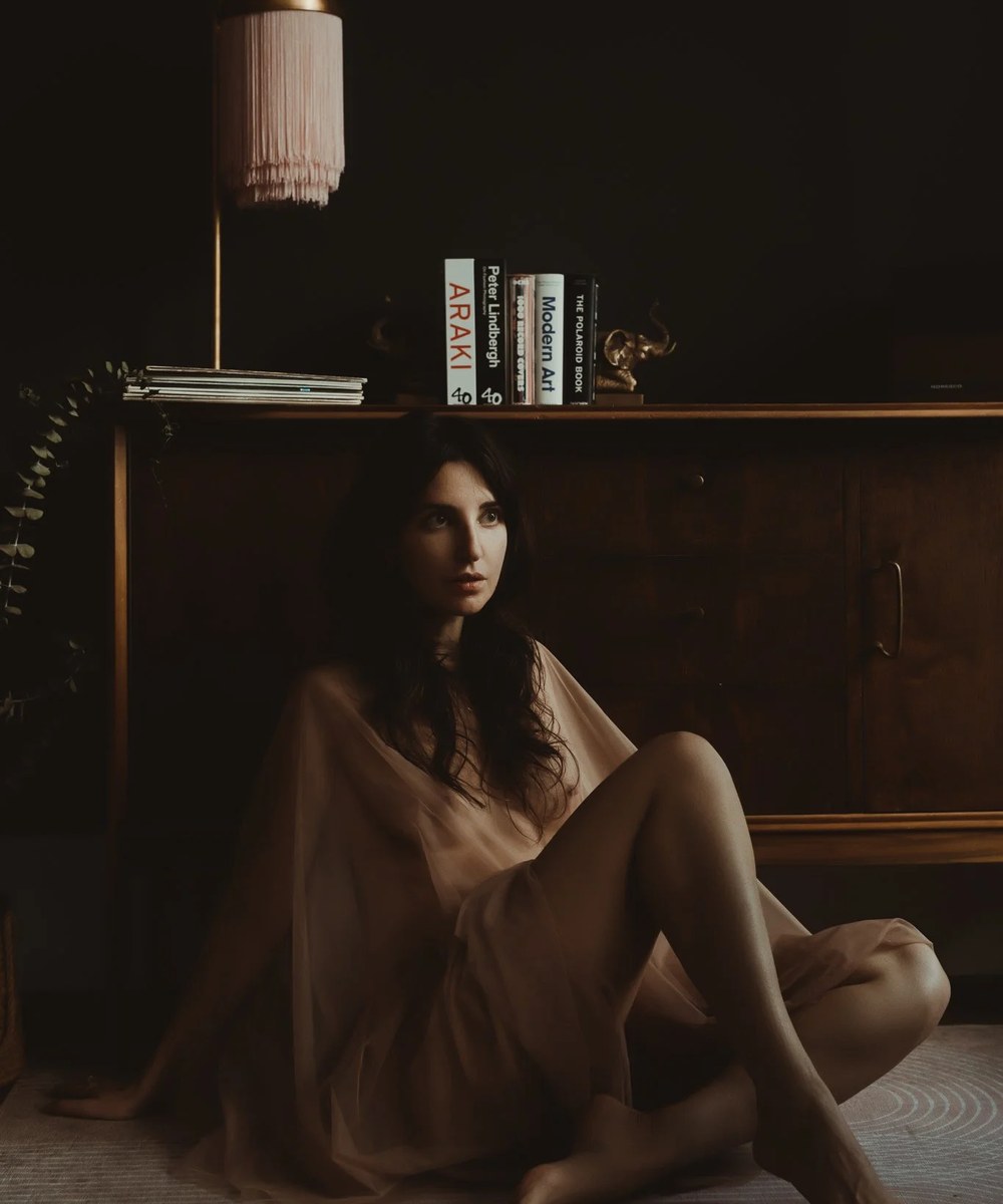 Pamela, founder of Aiota Photography, seated in her downtown Vancouver studio.